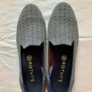 Rothy’s grey navy pattern with red stripe on heel